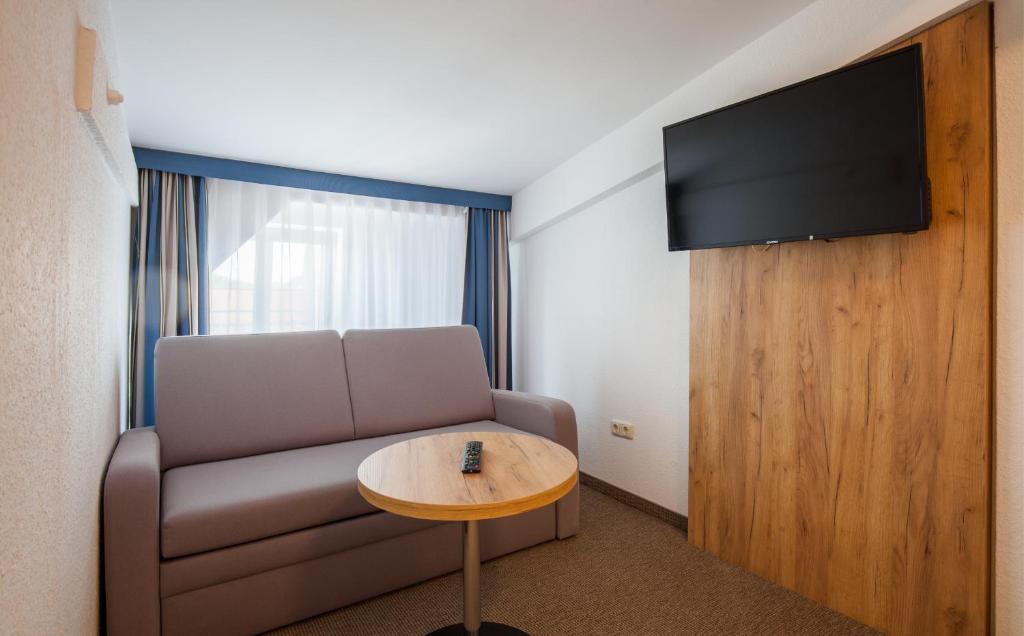 TV a/nebo společenská místnost v ubytování Sure Hotel by Best Western Wilhelmshaven City