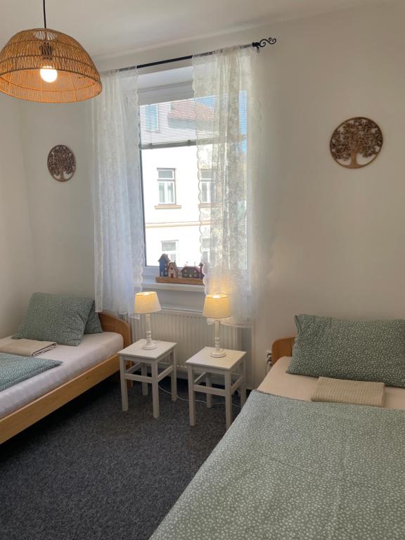 Łóżko lub łóżka w pokoju w obiekcie Penzion Ječmínek