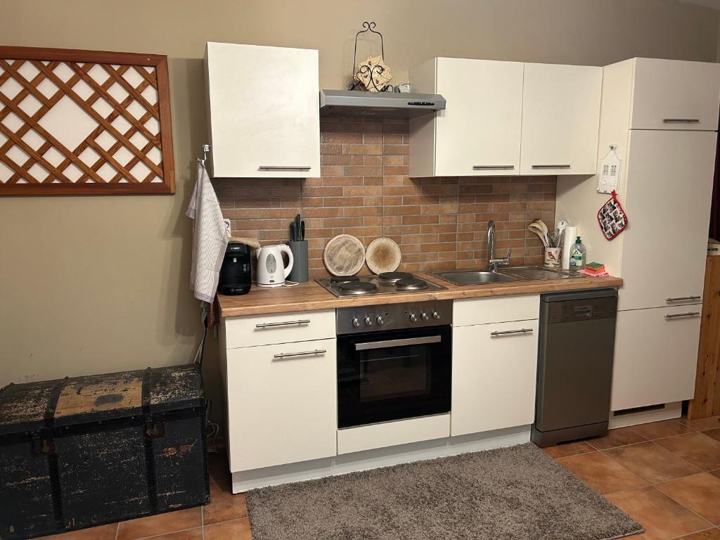 Kuchyň nebo kuchyňský kout v ubytování Miniferienwohnung für unkompliziertes Naturliebhaberpärchen