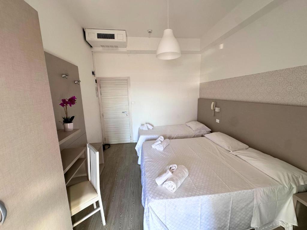 Postel nebo postele na pokoji v ubytování Hotel Ideal