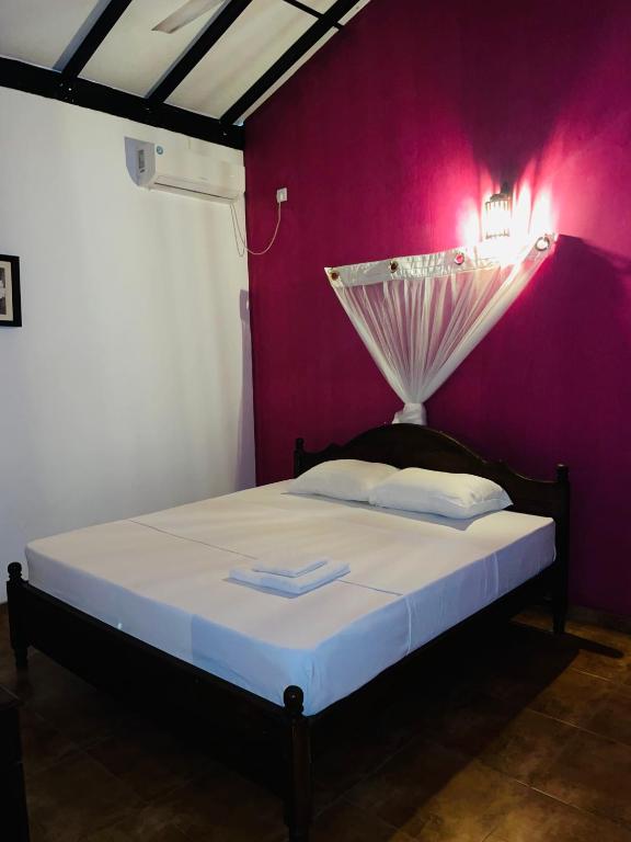 Postel nebo postele na pokoji v ubytování Keran villa