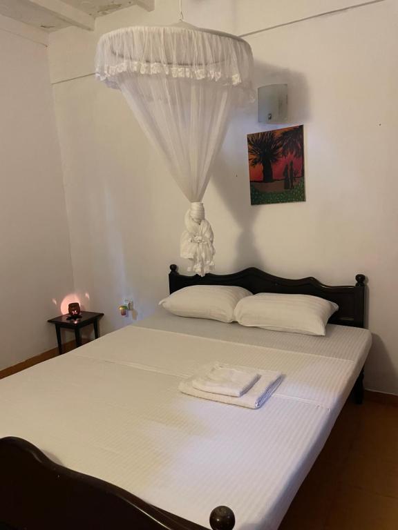 Postel nebo postele na pokoji v ubytování Keran villa