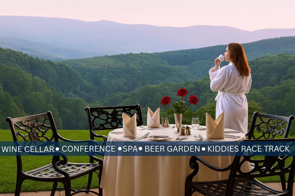 a woman talking on a cell phone at a table at Coach House Hotel &amp; Spa Tzaneen in Tzaneen