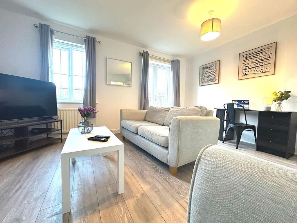 a living room with a couch and a table at Alma House by Blue Skies Stays in Hartlepool