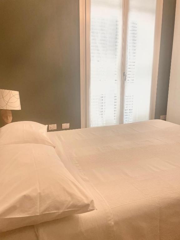 Postel nebo postele na pokoji v ubytování Abitare al 42