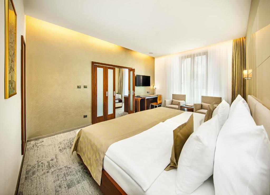 Postel nebo postele na pokoji v ubytování Wellness Hotel Diamant