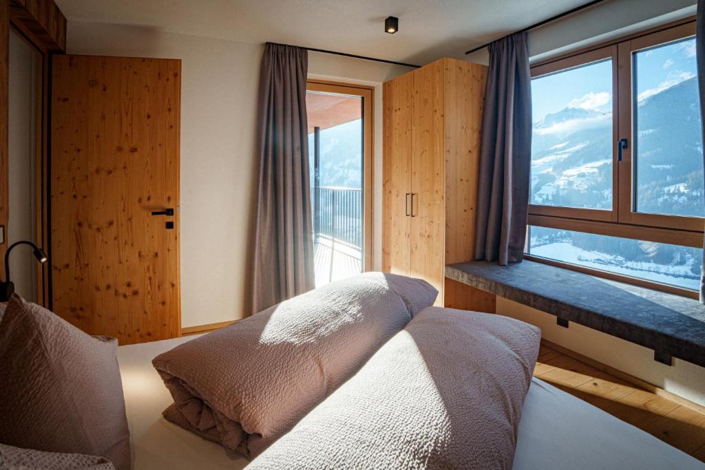 Postel nebo postele na pokoji v ubytování Lahnerhof Chalets