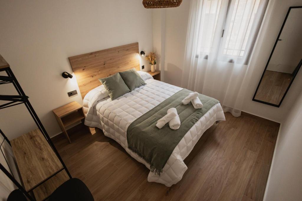 Postel nebo postele na pokoji v ubytování Mar de Olivos Baeza