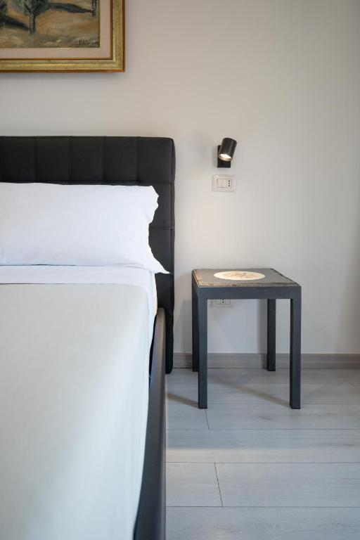Кровать или кровати в номере Catania Over Time - Tourist Rooms