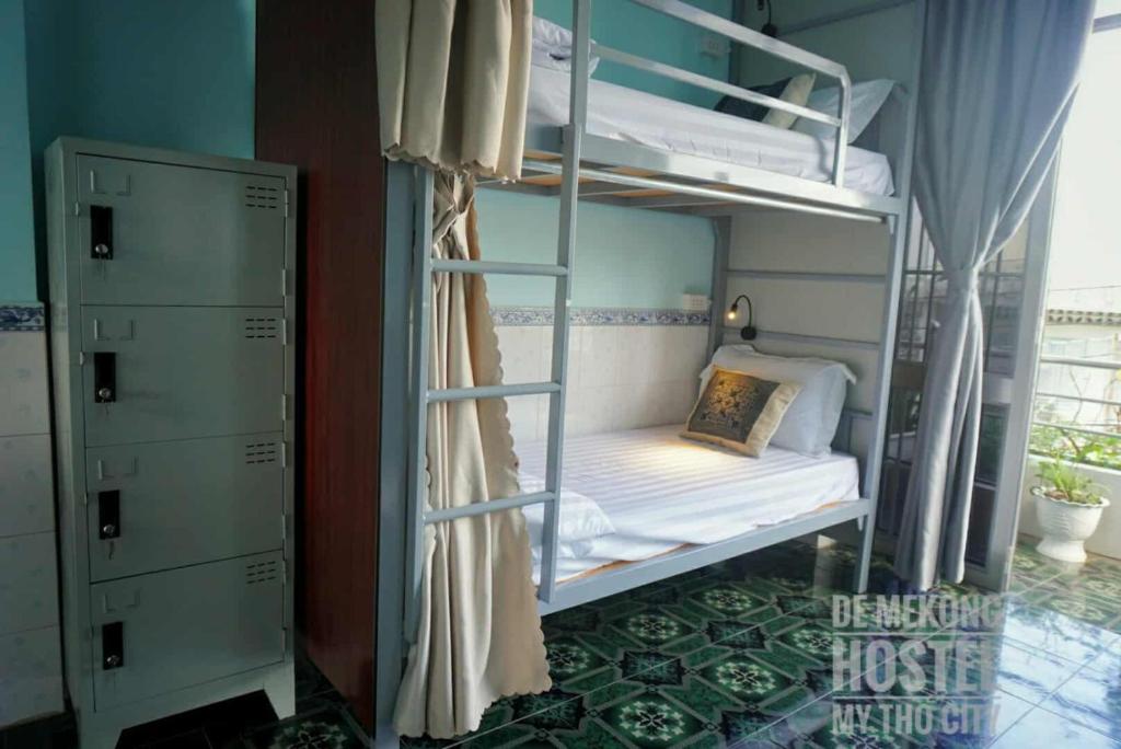 Ένα ή περισσότερα κρεβάτια σε δωμάτιο στο DE MEKONG HOSTEL MY THO City
