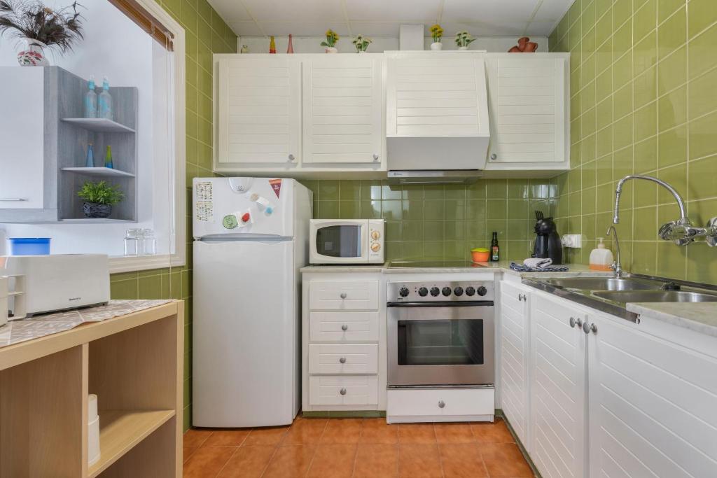 Kuchyň nebo kuchyňský kout v ubytování Apartamento Rose