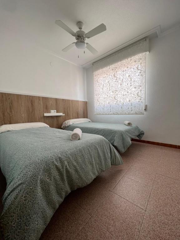 Postel nebo postele na pokoji v ubytování Apartamento CA VALEN 2