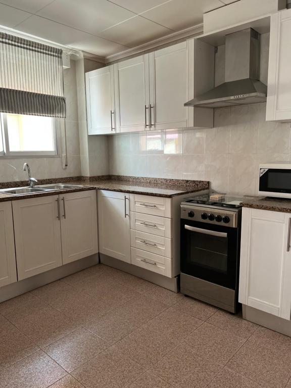 Kuchyň nebo kuchyňský kout v ubytování Apartamento CA VALEN 2
