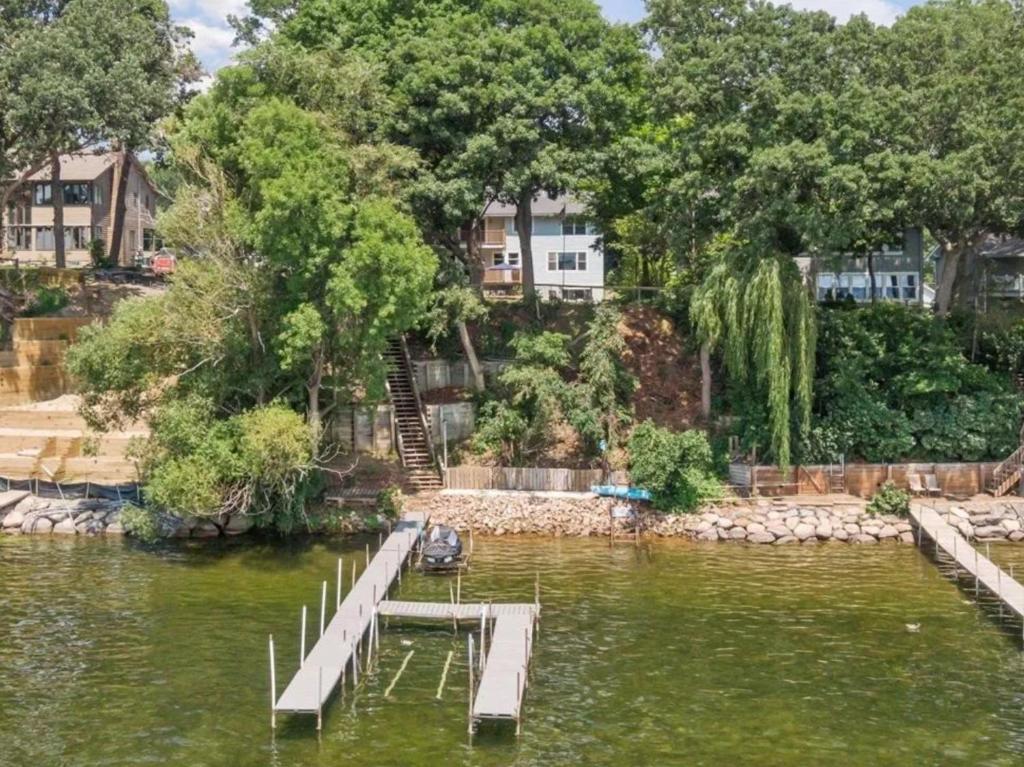 a dock in the middle of a body of water at Minnetonka Dream in Orono