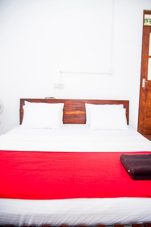 Postel nebo postele na pokoji v ubytování Minthu Homestay
