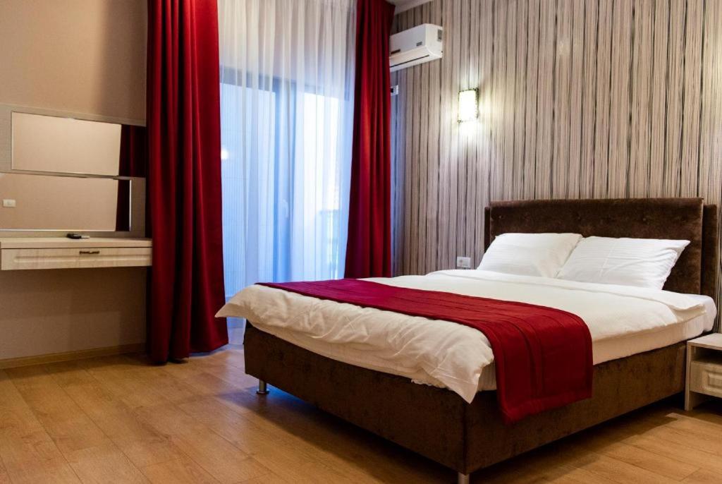 Postel nebo postele na pokoji v ubytování Friday Hotel