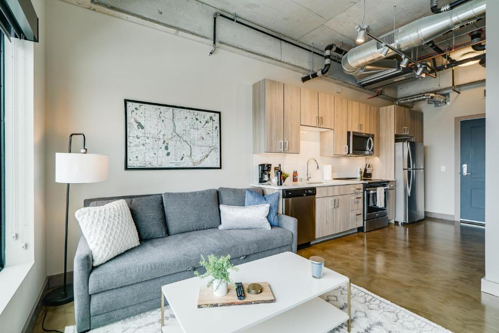 a living room with a couch and a table at Sable 802 - Alcove in Minneapolis