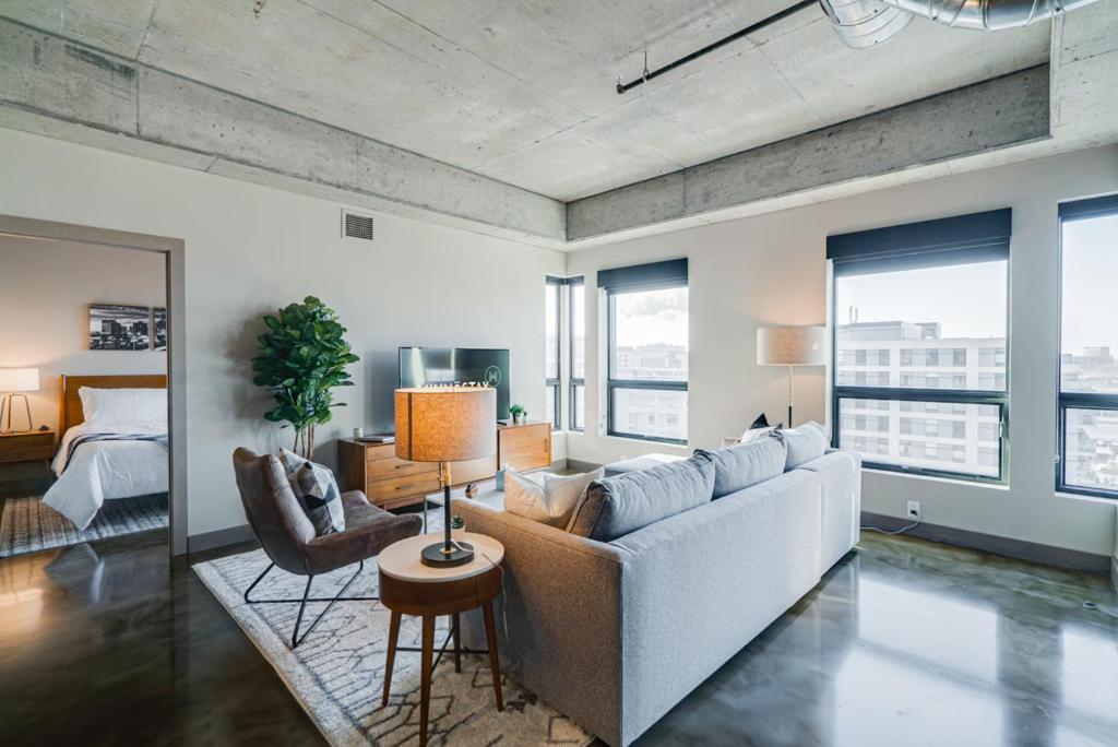 a living room with a couch and a bed at Sable 705 - Two Bedroom in Minneapolis