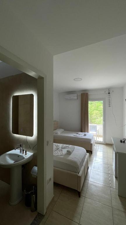 Postel nebo postele na pokoji v ubytování Hotel Skura
