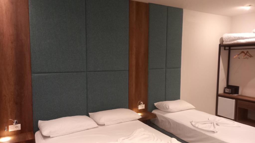 Postel nebo postele na pokoji v ubytování Hotel Aglon