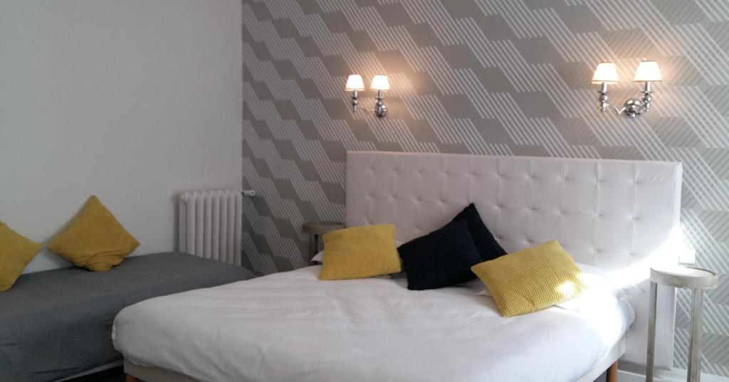 Cama o camas de una habitación en Régina Boutique Hotel