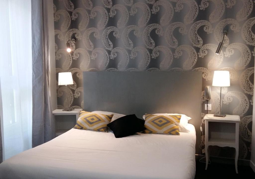 Cama o camas de una habitación en Régina Boutique Hotel
