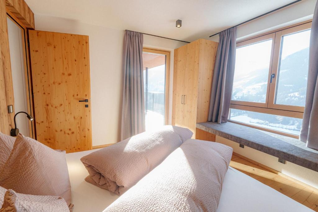 Postel nebo postele na pokoji v ubytování Lahnerhof Chalets