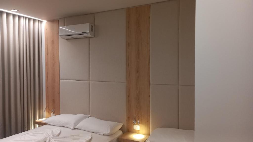 Postel nebo postele na pokoji v ubytování Hotel Aglon