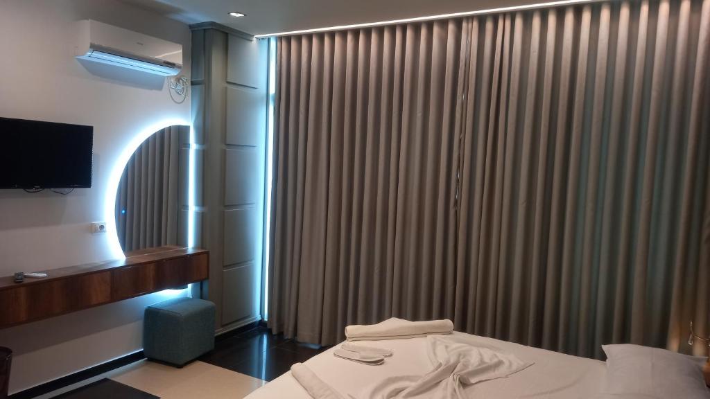 Postel nebo postele na pokoji v ubytování Hotel Aglon