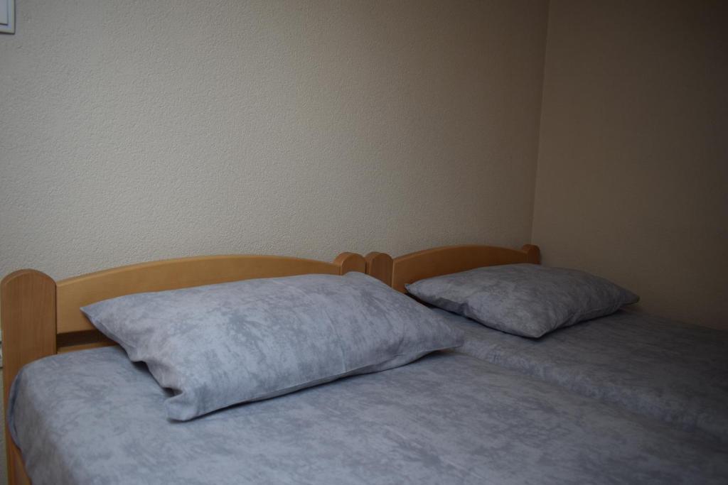 Postel nebo postele na pokoji v ubytování Apartmani Filip