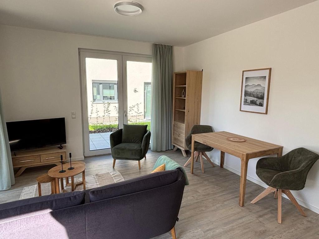 a living room with a couch and a table at Appartement Sonnenblume in Spangenberg