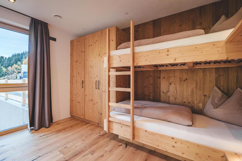 Postel nebo postele na pokoji v ubytování Lahnerhof Chalets