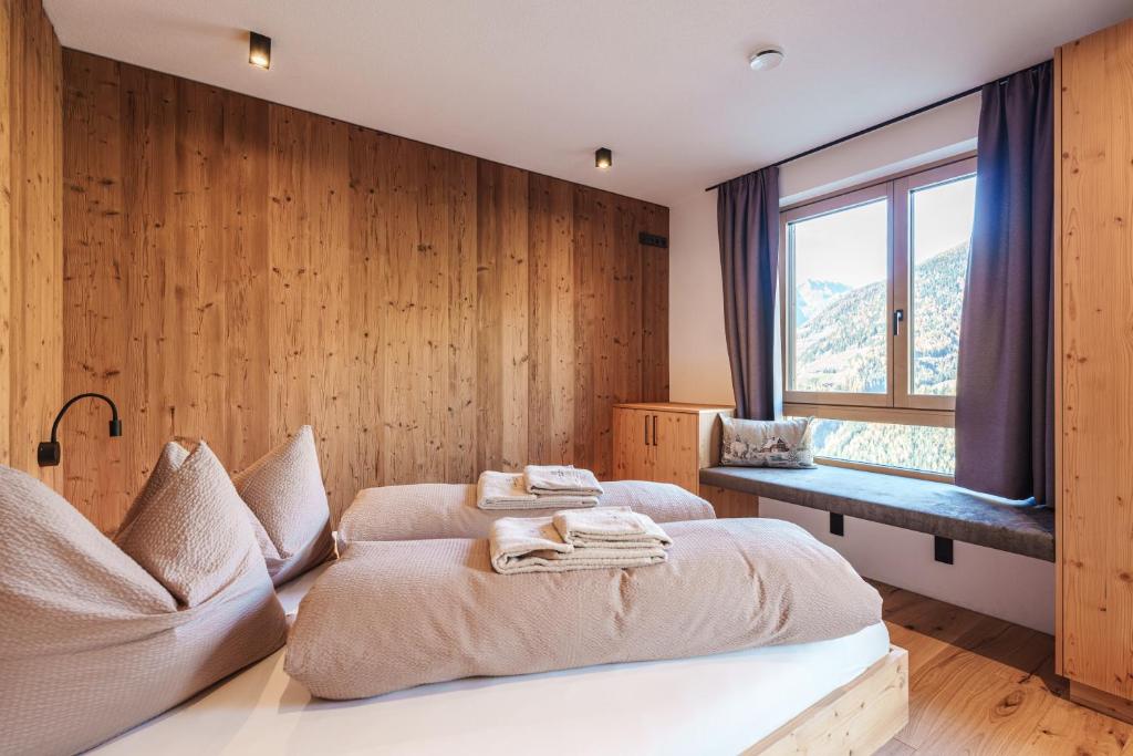 Postel nebo postele na pokoji v ubytování Lahnerhof Chalets