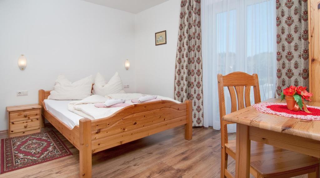 Voodi või voodid majutusasutuse Gästehaus Lutschounig toas