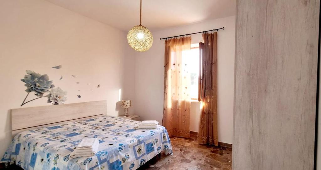 Postel nebo postele na pokoji v ubytování Villetta Lorena a Mancaversa
