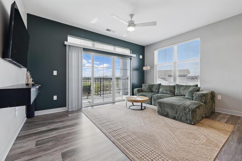 a living room with a couch and a tv at IRIE Living, Replenish Kg 2Bd Gym Pool BRAND NEW in Whitestown