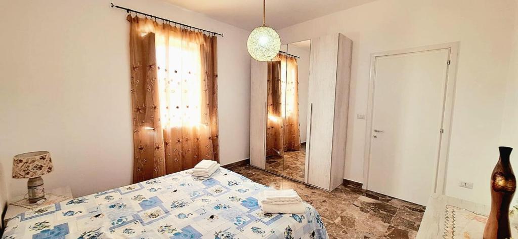 Postel nebo postele na pokoji v ubytování Villetta Lorena a Mancaversa