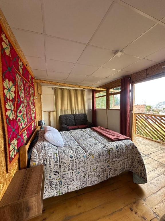 Postel nebo postele na pokoji v ubytování LA CASA DE RICKY "El balcón de las Montañas"