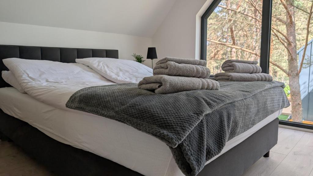 Letto o letti in una camera di Sosnowy Raj Borsk