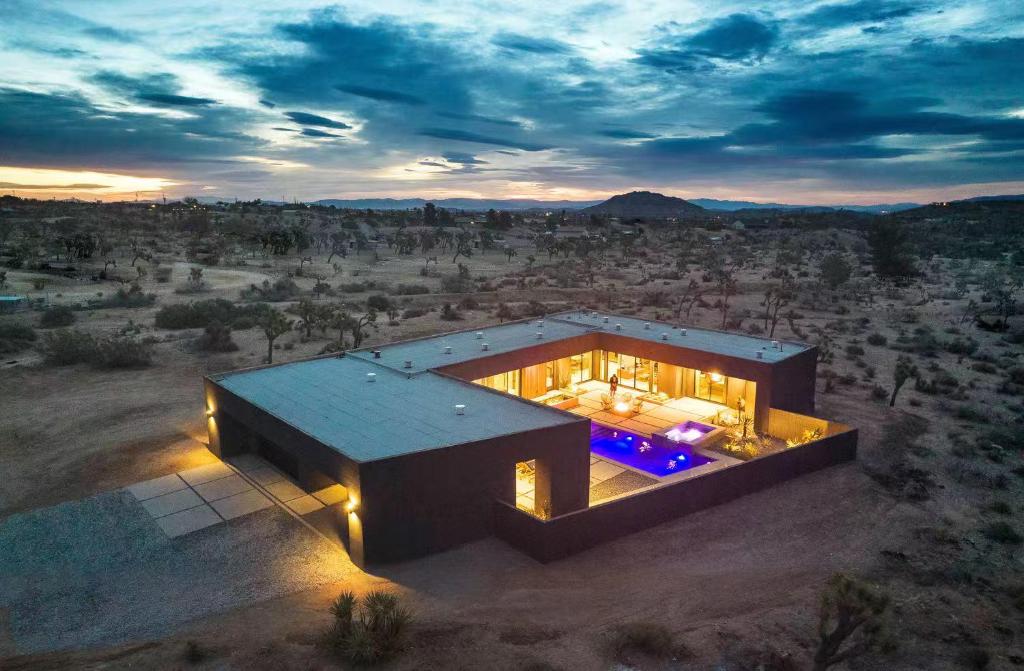 an aerial view of a house in the desert at Black C House Modern w pool spa in Yucca Valley