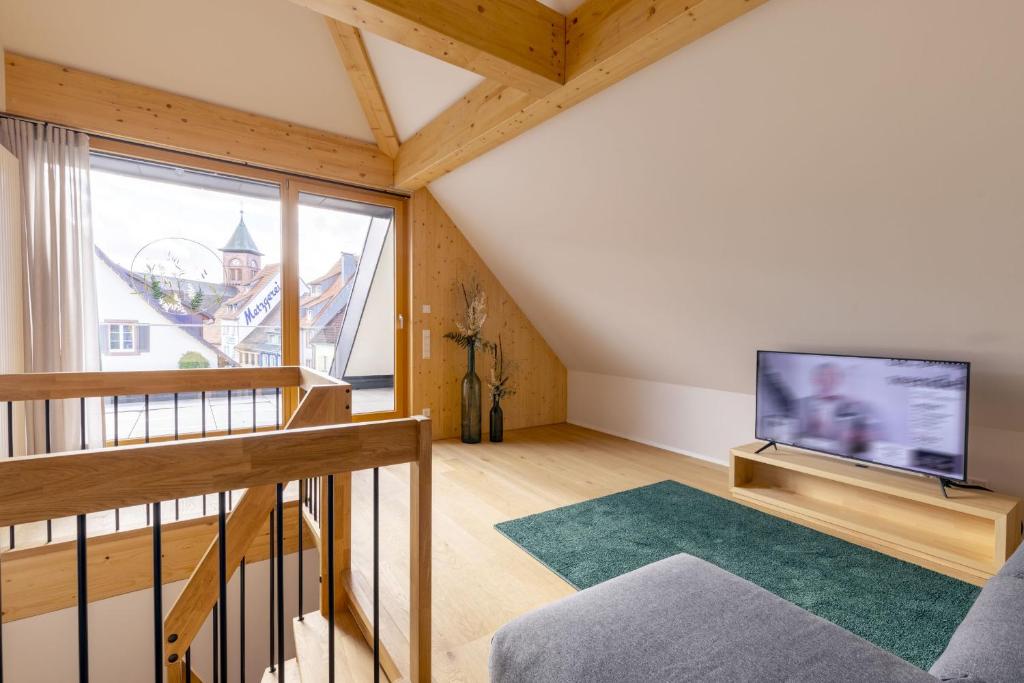 TV a/nebo společenská místnost v ubytování Apartments Bären