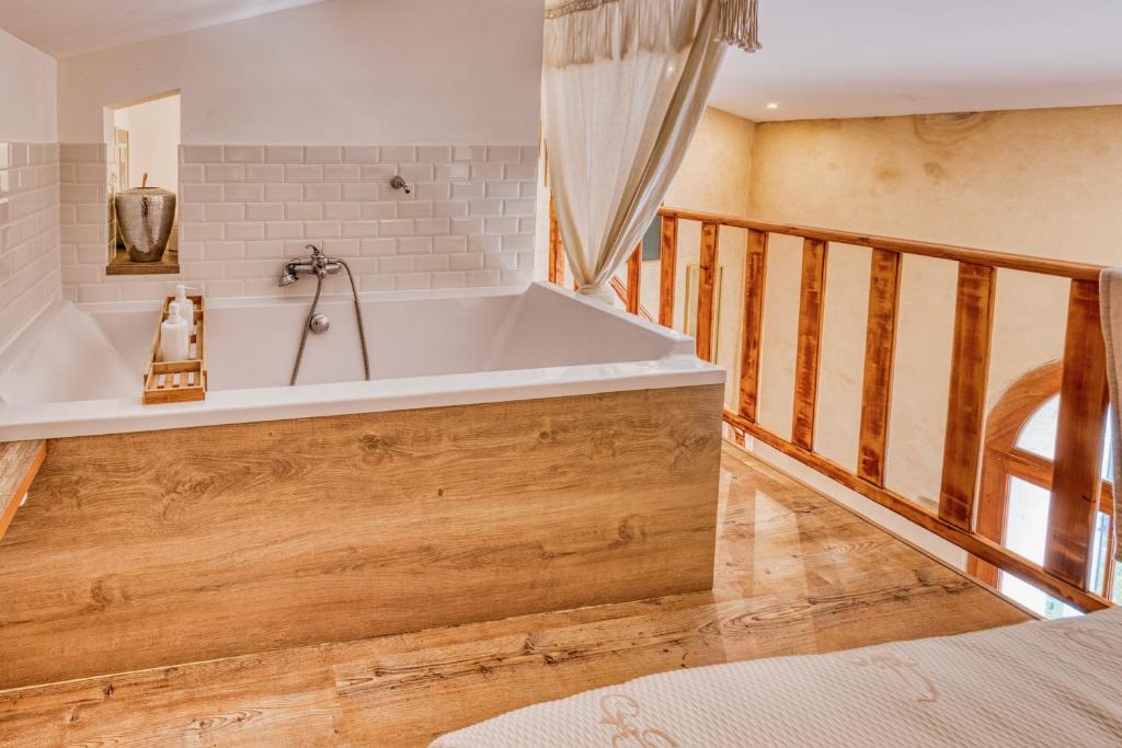 Postel nebo postele na pokoji v ubytování Bastide des Moulins