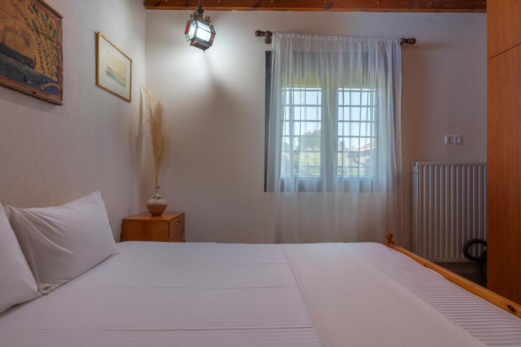 Postel nebo postele na pokoji v ubytování Pagiantes
