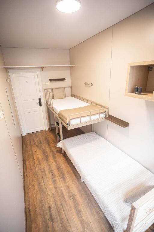 Postel nebo postele na pokoji v ubytování Hostel K3a