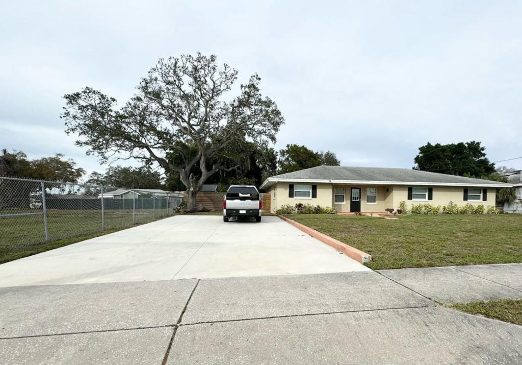 a truck parked in the driveway of a house at Home close to Clearwater beach in Largo