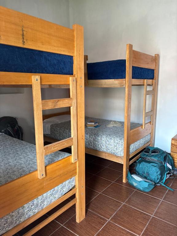 Postel nebo postele na pokoji v ubytování hostel arcoiris urubamba