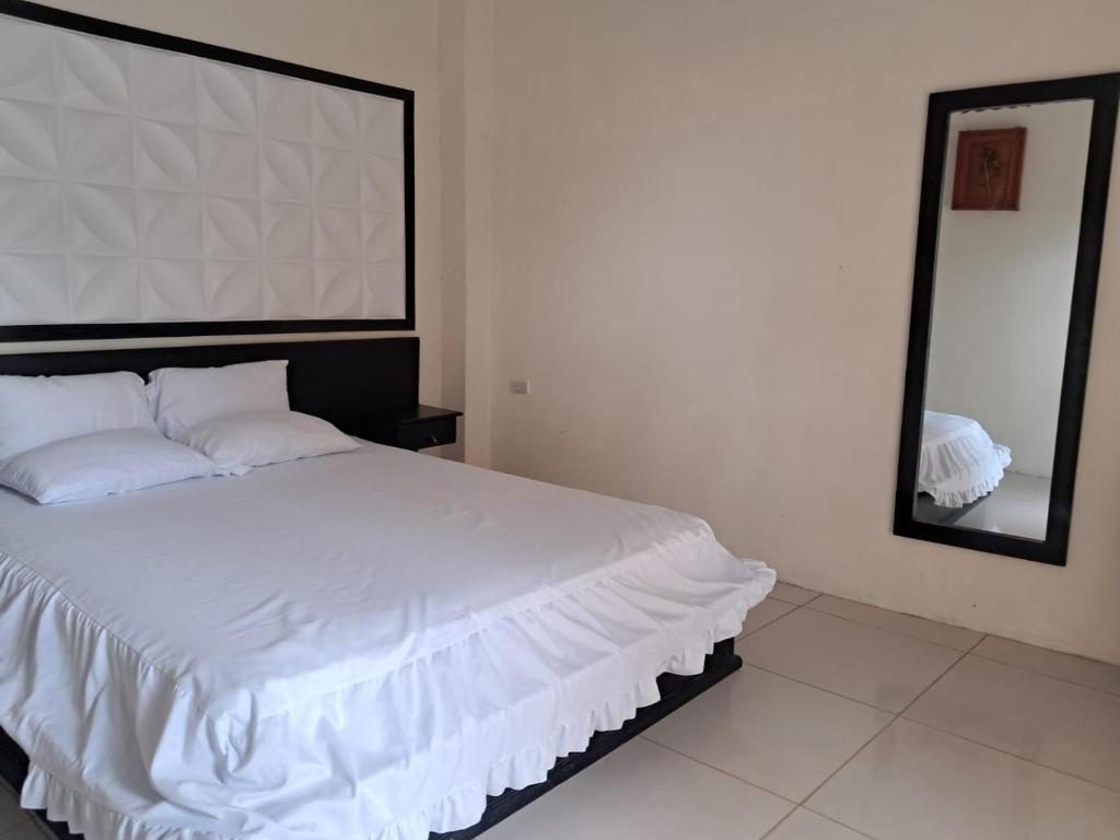 Postel nebo postele na pokoji v ubytování HotelCascol