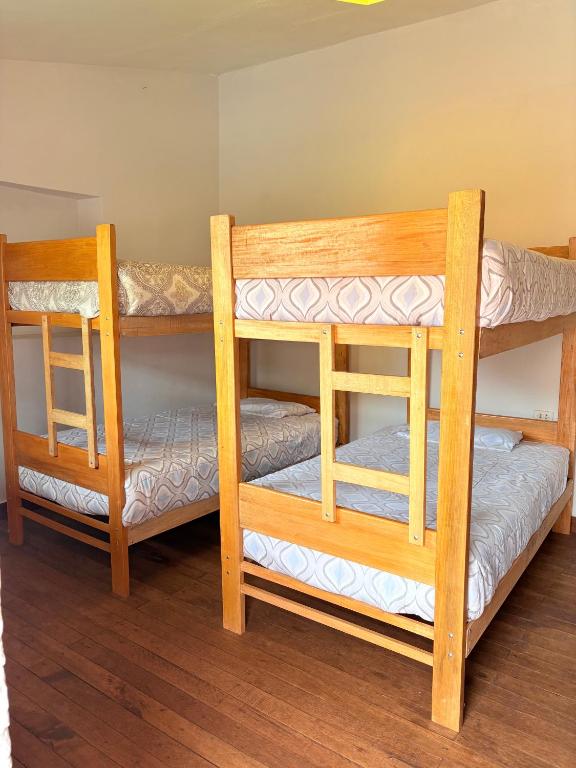 Postel nebo postele na pokoji v ubytování hostel arcoiris urubamba