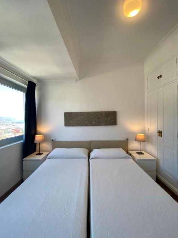 Postel nebo postele na pokoji v ubytování Apartamentos Bruja
