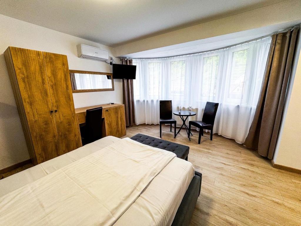 Postel nebo postele na pokoji v ubytování Hotel Dalia